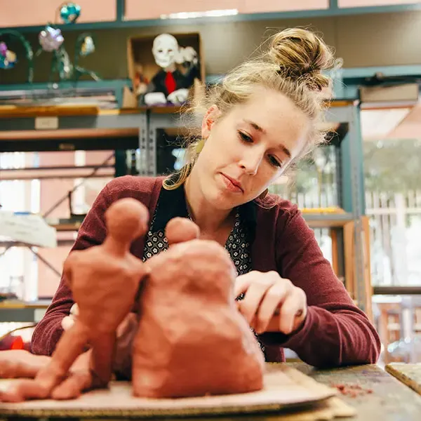 Female student working on a sculpture